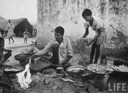 Indian-vendor-at-his-food-stall-at-temple-outside-of-village-of-Gaonkhera---1962.jpg