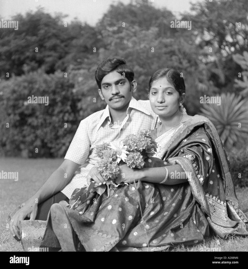 indian-man-woman-husband-wife-couple-sitting-lovingly-garden-india-A288M6.jpg