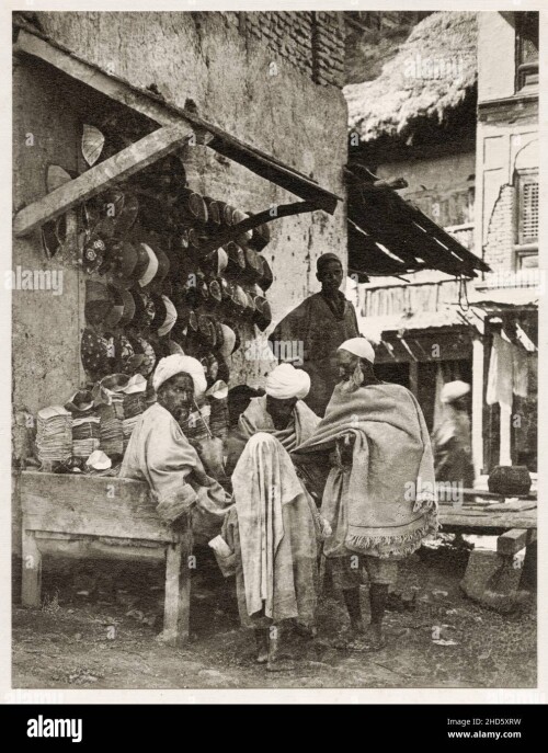 vintage-early-20th-century-photograph-hat-shop-srinagar-india-2HD5XRW.jpg